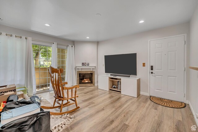 650 S Main St Unit 8102, Bountiful, UT 84010 - living area featuring a glass covered fireplace, light wood-style flooring, and recessed lighting
