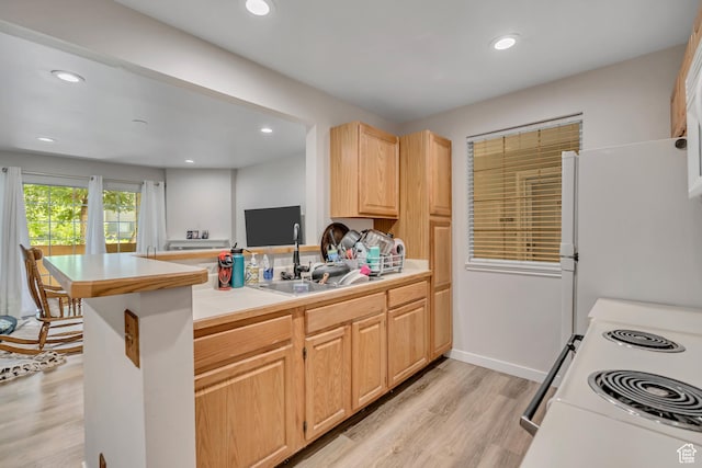 650 S Main St Unit 8102, Bountiful, UT 84010 - kitchen with light brown cabinetry, white appliances, a peninsula, light wood finished floors, and recessed lighting