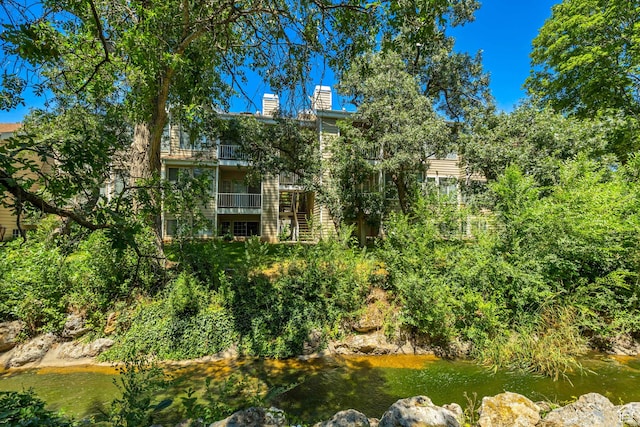 650 S Main St Unit 8102, Bountiful, UT 84010 - back of property featuring a chimney and a balcony