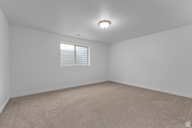 649 E 5650 S, Washington Terrace, UT 84405 - spare room with carpet flooring and a textured ceiling
