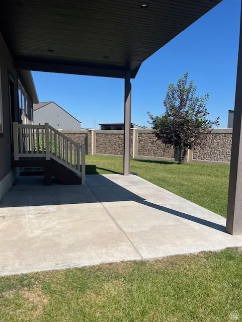 649 E 5650 S, Washington Terrace, UT 84405 - fenced backyard featuring a patio area