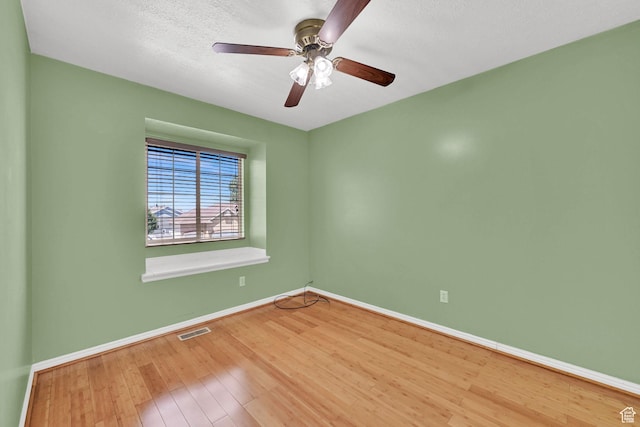 4188 S 2725 W, Roy, UT 84067 - empty room with wood finished floors, ceiling fan, and a textured ceiling