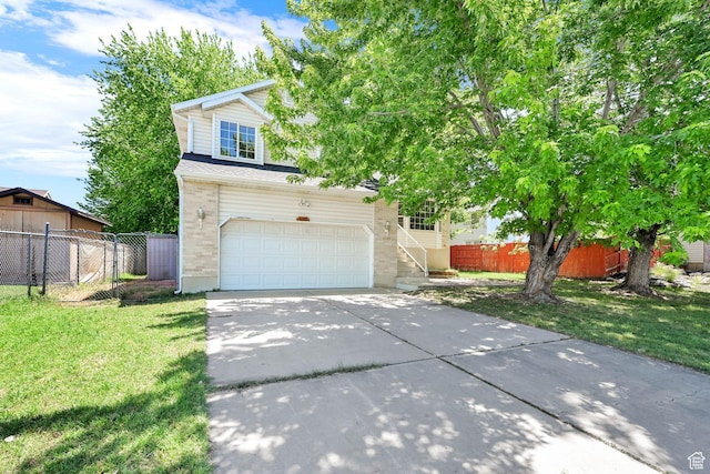 4188 S 2725 W, Roy, UT 84067 - view of property hidden behind natural elements with driveway, a garage, brick siding, and stairway