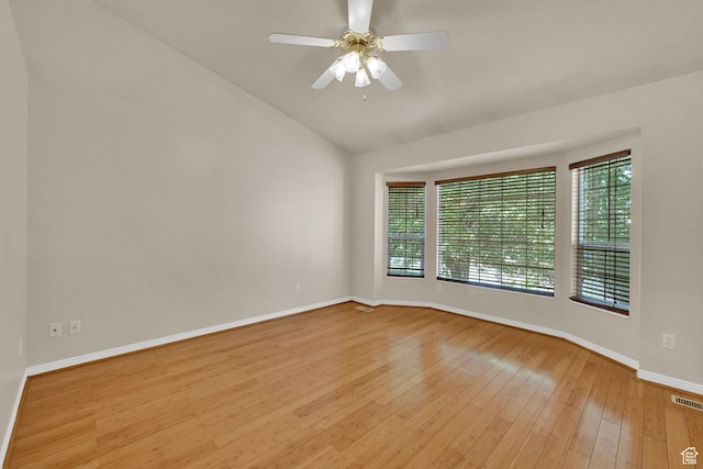 4188 S 2725 W, Roy, UT 84067 - empty room featuring vaulted ceiling, plenty of natural light, wood-type flooring, and a ceiling fan