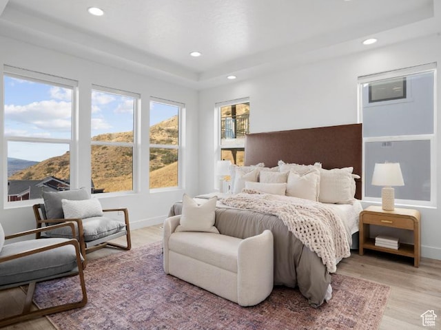 5885 N Canyon Rim Rd Unit 624, Lehi, UT 84043 - bedroom with a raised ceiling, light wood-style flooring, recessed lighting, and a mountain view