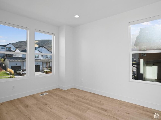 5885 N Canyon Rim Rd Unit 624, Lehi, UT 84043 - unfurnished room with wood finished floors, recessed lighting, and a residential view
