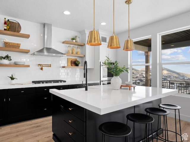 5885 N Canyon Rim Rd Unit 624, Lehi, UT 84043 - kitchen with wall chimney exhaust hood, dark cabinetry, open shelves, gas stovetop, and recessed lighting