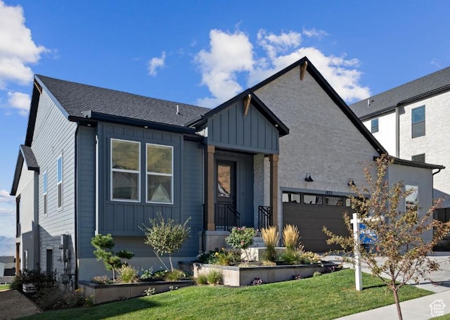 5885 N Canyon Rim Rd Unit 624, Lehi, UT 84043 - view of front of property featuring board and batten siding and a front lawn