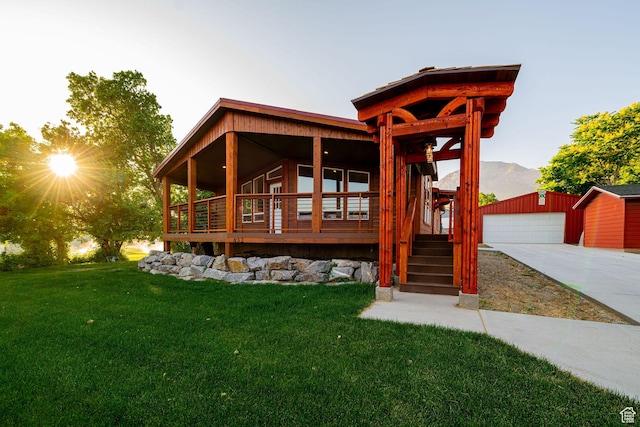 432 E 2700 N, North Ogden, UT 84414 - view of front of property featuring an outdoor structure, a front yard, a porch, and a mountain view