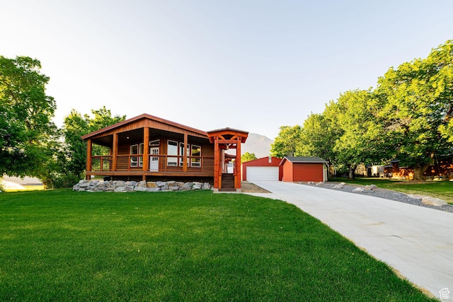 432 E 2700 N, North Ogden, UT 84414 - view of front of property featuring an outdoor structure, a front yard, and a garage