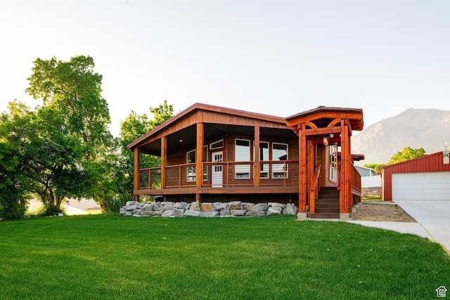 432 E 2700 N, North Ogden, UT 84414 - back of property featuring a lawn, a mountain view, and a garage