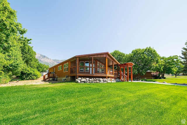 432 E 2700 N, North Ogden, UT 84414 - back of property with a lawn, a mountain view, and stairway