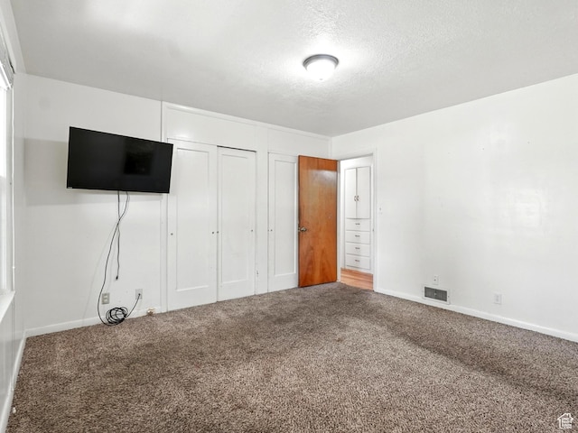 1951 W 4900 S, Roy, UT 84067 - unfurnished bedroom with carpet, a textured ceiling, and a closet