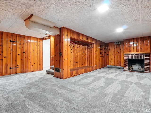 1951 W 4900 S, Roy, UT 84067 - finished below grade area featuring carpet floors, a fireplace, wooden walls, and stairway