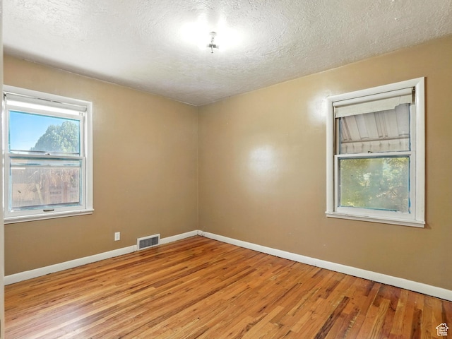 1951 W 4900 S, Roy, UT 84067 - unfurnished room featuring light wood-style flooring and a textured ceiling