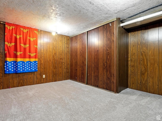 1951 W 4900 S, Roy, UT 84067 - carpeted empty room featuring wood walls and a textured ceiling