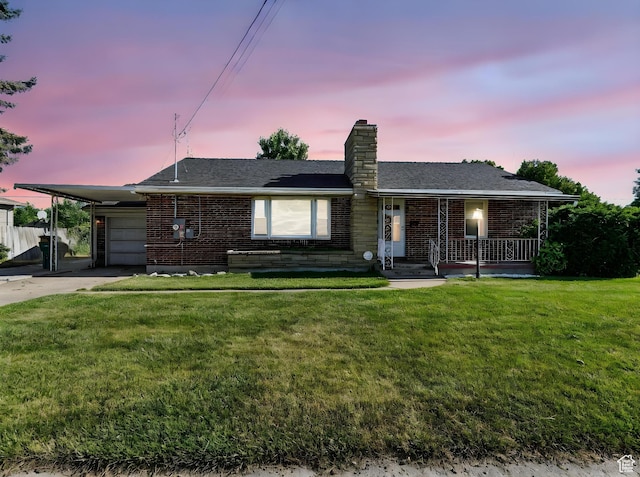 1951 W 4900 S, Roy, UT 84067 - ranch-style home with brick siding, driveway, a chimney, covered porch, and a front yard