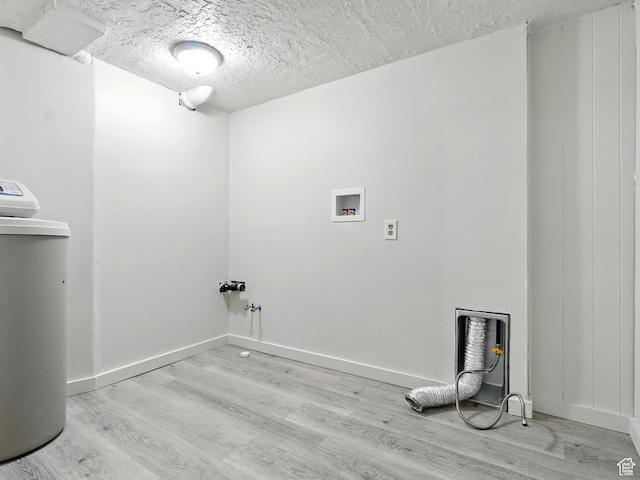 1951 W 4900 S, Roy, UT 84067 - laundry room with light wood-style floors, a textured ceiling, and hookup for a washing machine