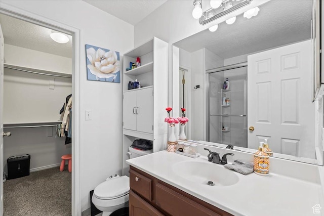 3186 N 1175 E, Layton, UT 84040 - full bathroom featuring vanity, a shower stall, a walk in closet, and a textured ceiling