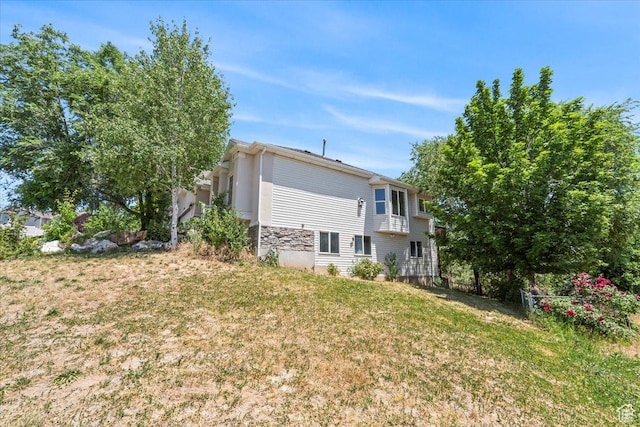 3186 N 1175 E, Layton, UT 84040 - back of property featuring a lawn and stone siding