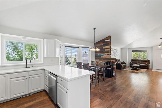 3186 N 1175 E, Layton, UT 84040 - kitchen featuring stainless steel dishwasher, a peninsula, lofted ceiling, dark wood finished floors, and white cabinets
