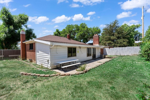 680 E 2800 N, North Ogden, UT 84414 - back of house with a chimney and a patio