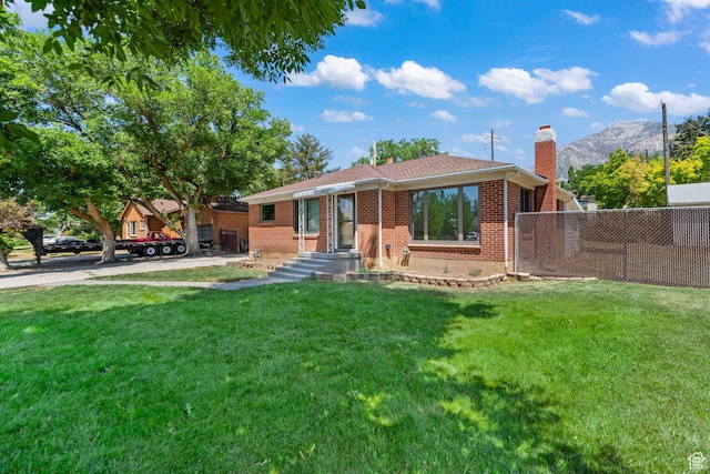 680 E 2800 N, North Ogden, UT 84414 - view of front facade featuring a chimney, a mountain view, and brick siding