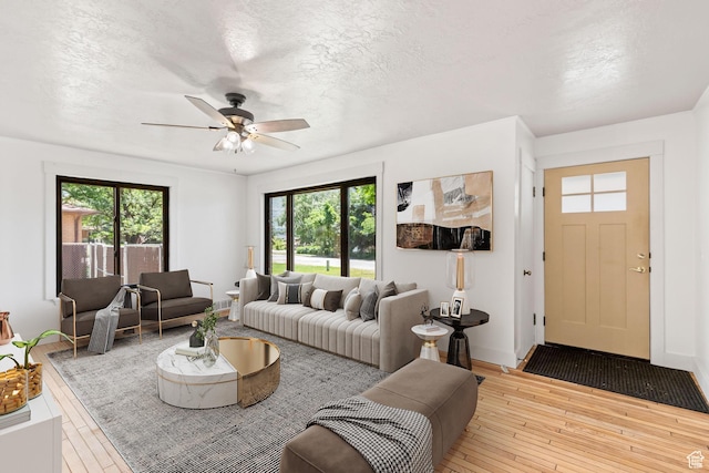 680 E 2800 N, North Ogden, UT 84414 - living room featuring hardwood / wood-style flooring, ceiling fan, and a textured ceiling