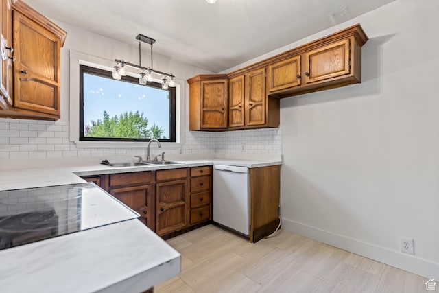 680 E 2800 N, North Ogden, UT 84414 - kitchen with brown cabinetry, decorative backsplash, dishwasher, and light countertops