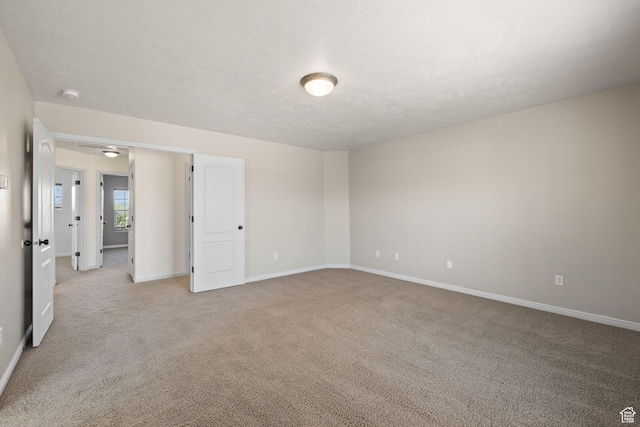 3991 W Hollandia Ln, West Jordan, UT 84084 - spare room with light colored carpet, a textured ceiling, and a smoke detector