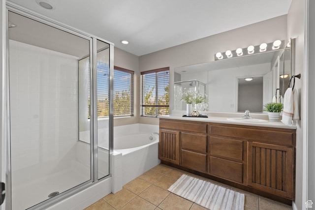 3991 W Hollandia Ln, West Jordan, UT 84084 - bathroom featuring vanity, a bath, a shower stall, and tile patterned flooring