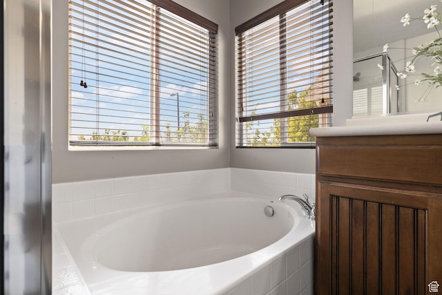 3991 W Hollandia Ln, West Jordan, UT 84084 - bathroom with a bath, vanity, and a stall shower