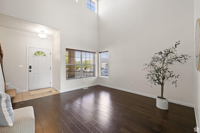 3991 W Hollandia Ln, West Jordan, UT 84084 - entryway featuring healthy amount of natural light, wood-type flooring, and a towering ceiling