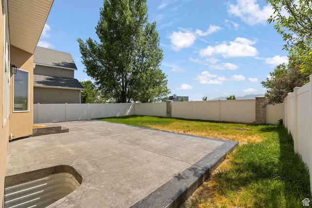 3991 W Hollandia Ln, West Jordan, UT 84084 - fenced backyard featuring a patio
