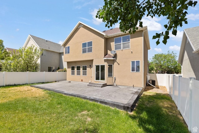 3991 W Hollandia Ln, West Jordan, UT 84084 - back of house featuring a fenced backyard, a patio area, and stucco siding