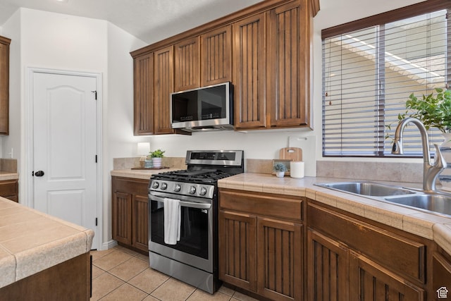 3991 W Hollandia Ln, West Jordan, UT 84084 - kitchen featuring stainless steel appliances and light tile patterned floors