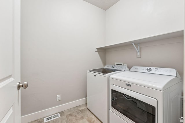 11103 S Kiwano Way W, South Jordan, UT 84009 - laundry area with washer and clothes dryer and baseboards