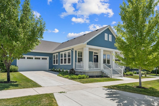 11103 S Kiwano Way W, South Jordan, UT 84009 - view of front of property with a porch, an attached garage, driveway, roof with shingles, and a front lawn