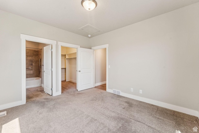 11103 S Kiwano Way W, South Jordan, UT 84009 - unfurnished bedroom featuring carpet, a walk in closet, attic access, a closet, and connected bathroom
