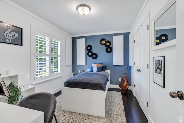 914 W Red Fox Ln, Saratoga Springs, UT 84045 - bedroom with dark wood-type flooring and a textured ceiling