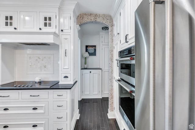 914 W Red Fox Ln, Saratoga Springs, UT 84045 - kitchen featuring stainless steel appliances, dark countertops, white cabinets, dark wood-type flooring, and tasteful backsplash