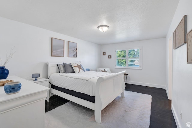 914 W Red Fox Ln, Saratoga Springs, UT 84045 - bedroom featuring dark wood-type flooring and a textured ceiling