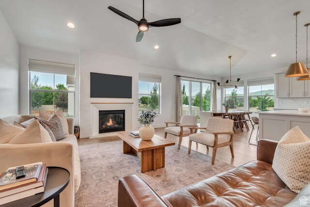 387 S 300 E, Midway, UT 84049 - living room featuring plenty of natural light, ceiling fan, light wood-style flooring, recessed lighting, and a glass covered fireplace