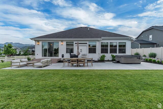 387 S 300 E, Midway, UT 84049 - rear view of house with a hot tub, a patio area, an outdoor hangout area, a mountain view, and a shingled roof