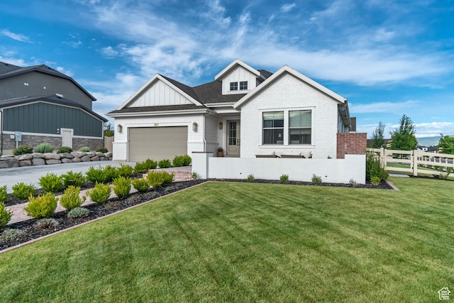 387 S 300 E, Midway, UT 84049 - view of front of house with board and batten siding, an attached garage, concrete driveway, and brick siding