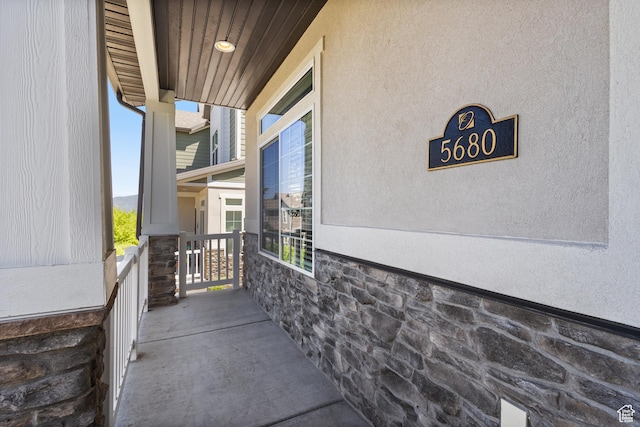 5680 W Pelican Ridge Ln, Salt Lake City, UT 84118 - doorway to property featuring stone siding and stucco siding