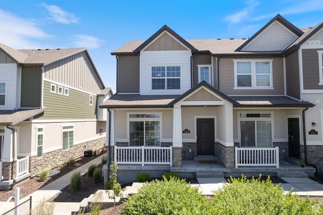 5680 W Pelican Ridge Ln, Salt Lake City, UT 84118 - craftsman-style home featuring a porch, stone siding, board and batten siding, and roof with shingles