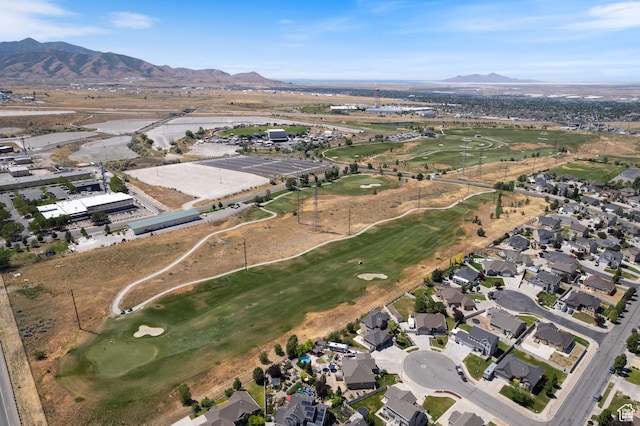 5680 W Pelican Ridge Ln, Salt Lake City, UT 84118 - aerial overview of property's location featuring a mountain backdrop, a local golf course, and nearby suburban area