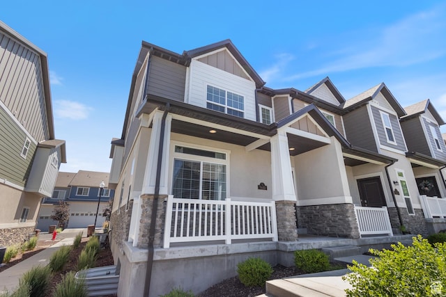 5680 W Pelican Ridge Ln, Salt Lake City, UT 84118 - craftsman inspired home featuring stone siding, covered porch, and stucco siding