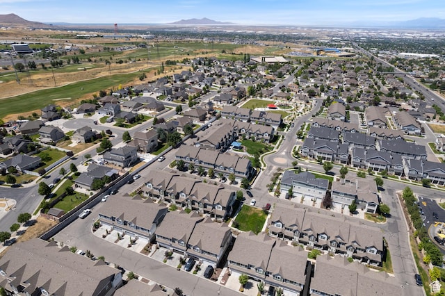 5680 W Pelican Ridge Ln, Salt Lake City, UT 84118 - aerial overview of property's location featuring a mountainous background, nearby suburban area, and a local golf course